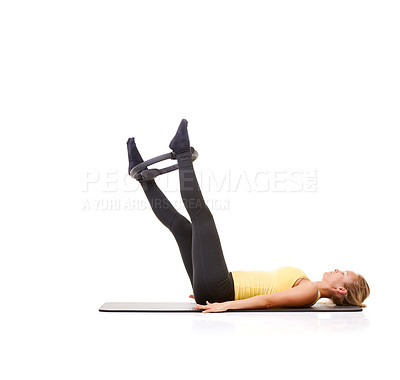 Buy stock photo Woman, pilates ring and legs for wellness workout on yoga mat or resistance training, strength or studio white background. Female person, equipment for muscle flexibility or balance, health or mockup