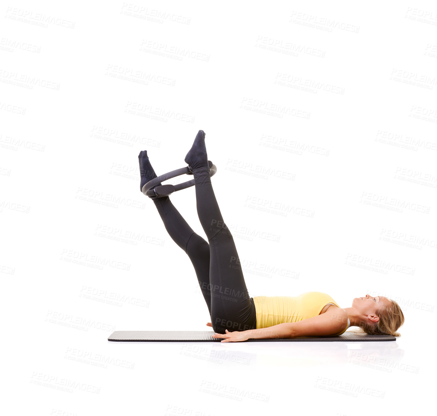 Buy stock photo Woman, pilates ring and legs for wellness workout on yoga mat or resistance training, strength or studio white background. Female person, equipment for muscle flexibility or balance, health or mockup