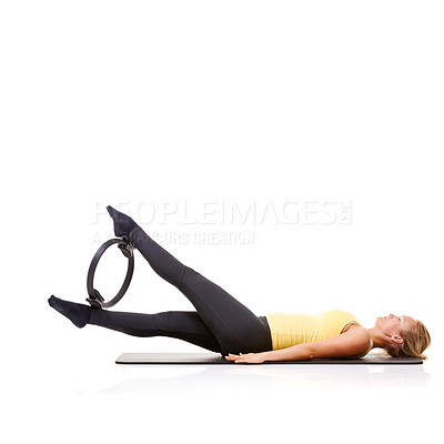 Buy stock photo Woman, pilates ring and legs for wellness balance on yoga mat for resistance training, strength or studio white background. Female person, equipment for muscle flexibility, healthy care or mockup