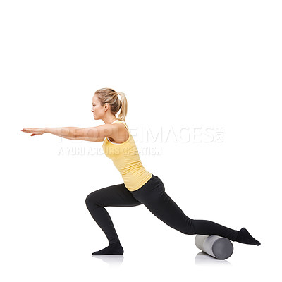 Buy stock photo A young woman performing lunges while using a foam roller - isolated