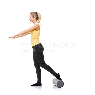 Buy stock photo Studio, foam roller and woman training for leg strength challenge, balance or rehabilitation fitness. Pilates, mockup space or girl workout for body wellness, recovery or activity on white background