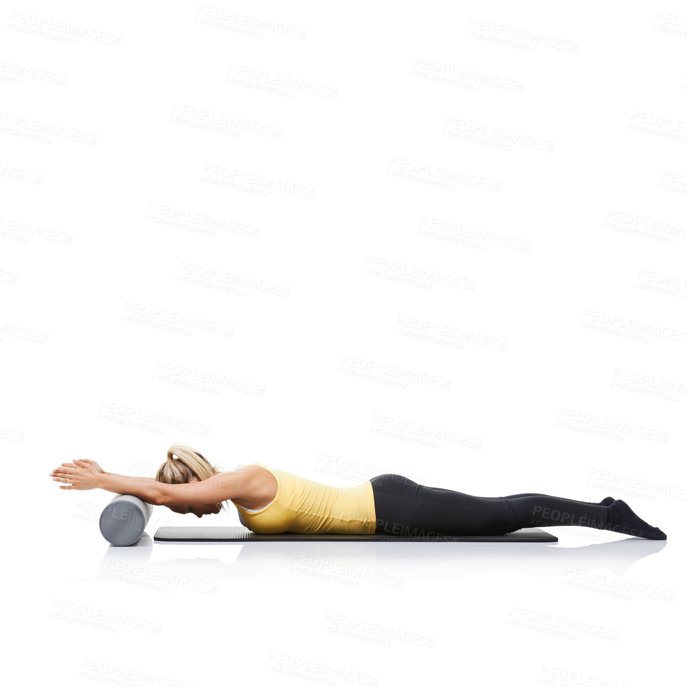 Buy stock photo Stretching, foam roller and woman in a studio for exercise, wellness or gym routine with yoga mat. Stability, balance and young female athlete from Australia with body workout by white background.