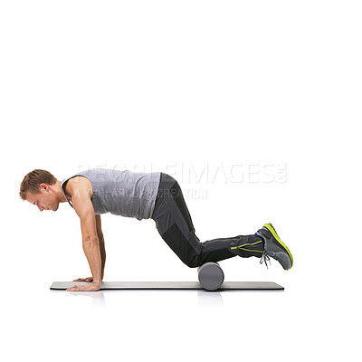 Buy stock photo Pilates, foam roller and man in a studio for exercise, stretching or gym routine with yoga mat. Stability, balance and young male athlete from Australia with body workout by white background.