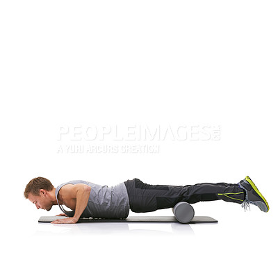 Buy stock photo Training, foam roller and man in floor push up for bodybuilding commitment, muscle growth or arm strength exercise. Plank balance, mockup studio space and male fitness athlete on white background