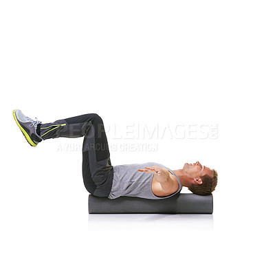 Buy stock photo Balance exercise, foam roller and man in pilates workout, stability and endurance performance. Floor, mockup studio space and athlete fitness for core muscle strength development on white background