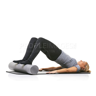 Buy stock photo Core exercise, foam roller and studio woman with bridge workout, balance activity or wellness for gym pilates on floor. Fitness, mockup space and girl body development on yoga mat on white background