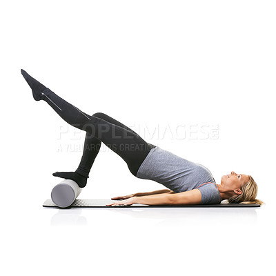 Buy stock photo Legs workout, foam roller and studio woman with bridge exercise, pilates balance or gym performance challenge. Ground, body training and athlete core muscle, strength or fitness on white background