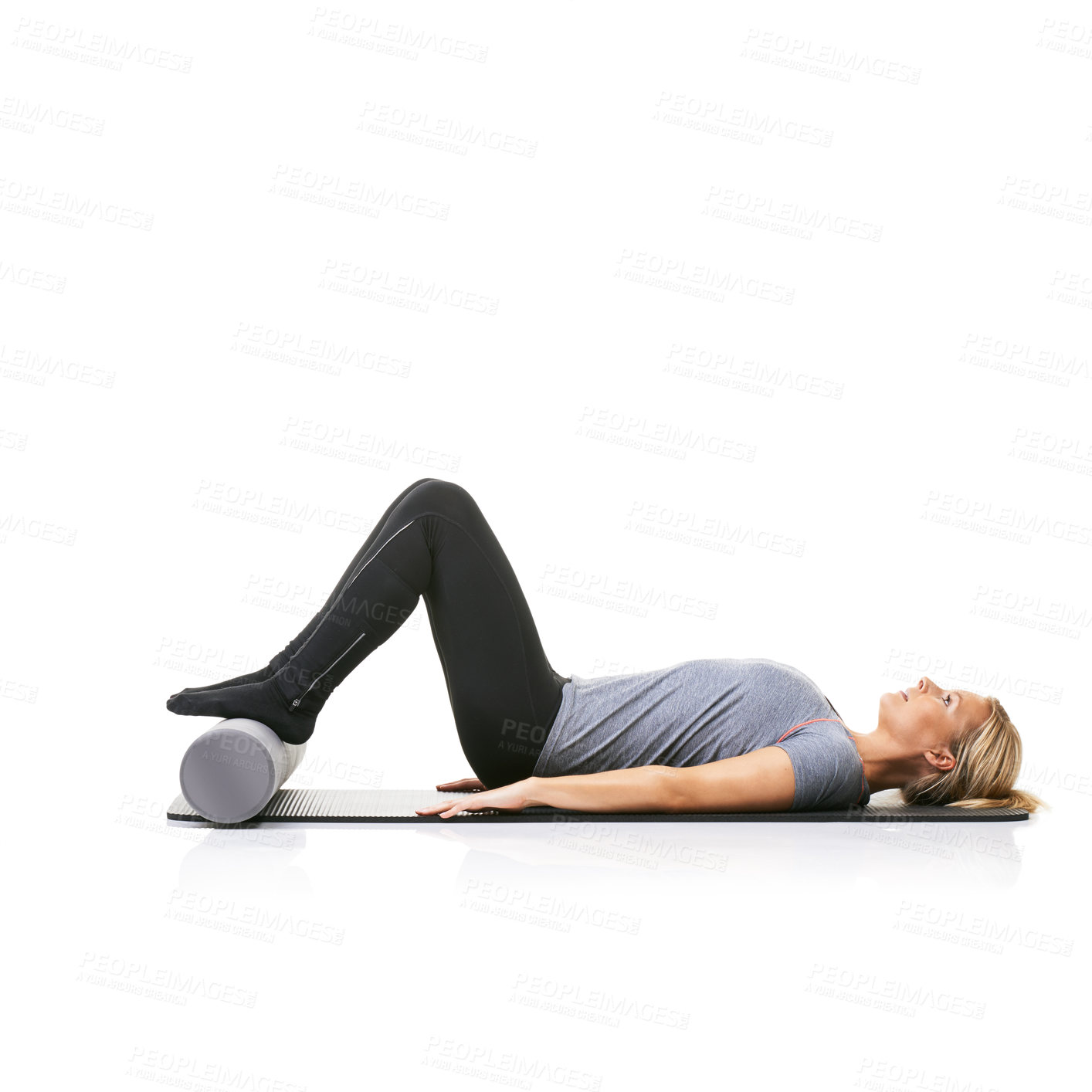 Buy stock photo Floor exercise, foam roller and studio woman workout for active lifestyle, gym pilates and rest after fitness routine. Ground, mockup space and girl body development on yoga mat on white background