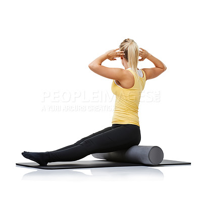 Buy stock photo Yoga fitness, foam roller and person stretching back for spine posture training, wellness challenge or active performance. Studio floor, exercise mat and athlete physical activity on white background