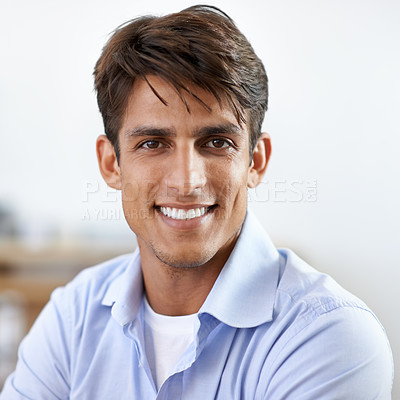 Buy stock photo A handsome young smiling businessman