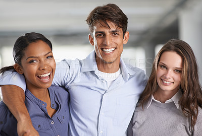 Buy stock photo A group of businesspeople embracing each other in the office