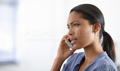 Buy stock photo A beautiful young ethnic woman speaking on her cellphone - copyspace