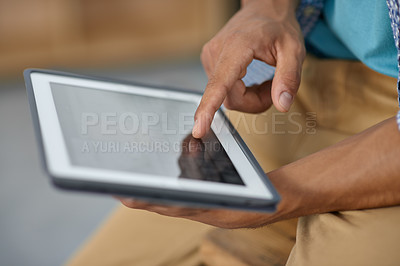 Buy stock photo Cropped image of someone working on a digital tablet - closeup