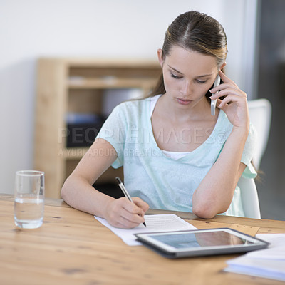 Buy stock photo Creative, woman and phone call while writing notes with tablet in office for planning research, information and communication in agency. Designer talking on cellphone with documents and digital tech