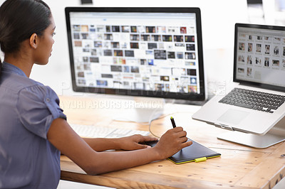 Buy stock photo Cropped shot of an attractive young businesswoman using a wireless device