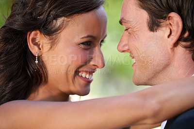 Buy stock photo Wedding day, hug and bride and groom in garden for event, celebration or union outdoor. Love, happy and excited couple embrace at marriage, ceremony or event with support, trust and romance at a park