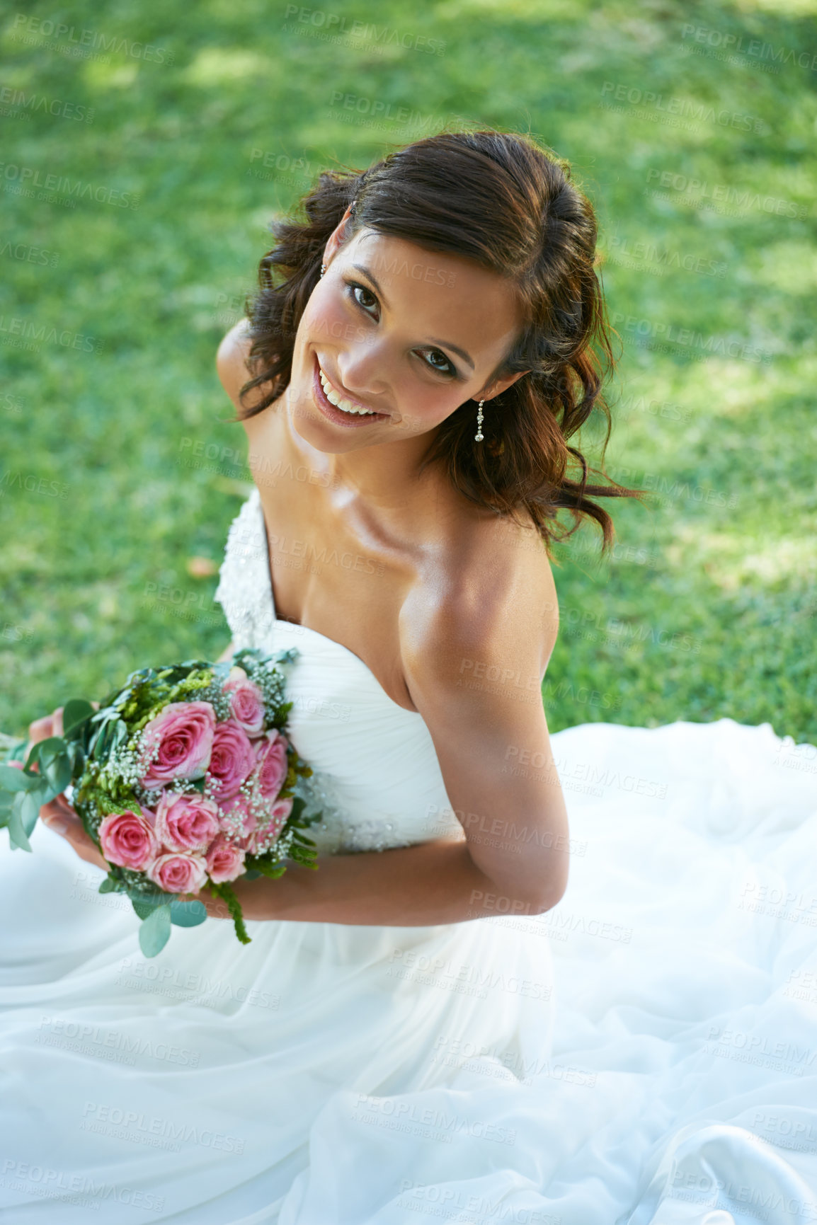 Buy stock photo A gorgeous bride sitting on grass