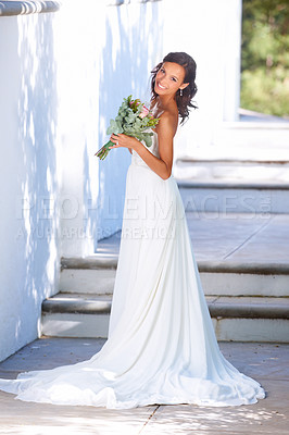 Buy stock photo A beautiful young bride standing outside with her bouquet