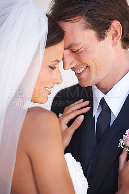 Buy stock photo A happy newlywed couple sharing a tender moment