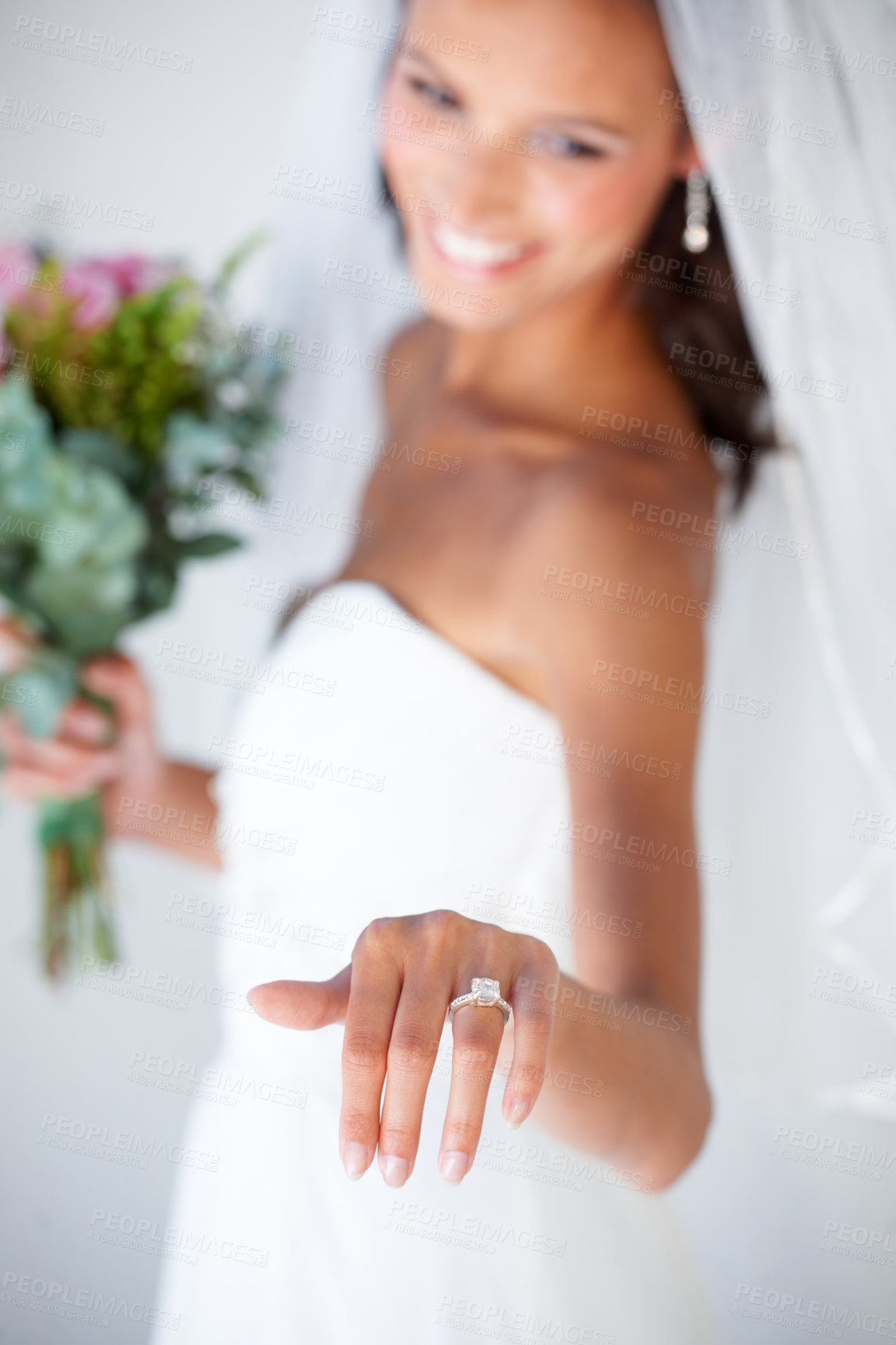 Buy stock photo A gorgeous young bride showing off her wedding ring