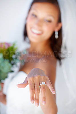 Buy stock photo Wedding ring, hand and bride with diamond, jewellery and pride for commitment, celebration or marriage. Happy, woman and closeup on engagement jewelry with bridal flowers, bouquet and happiness