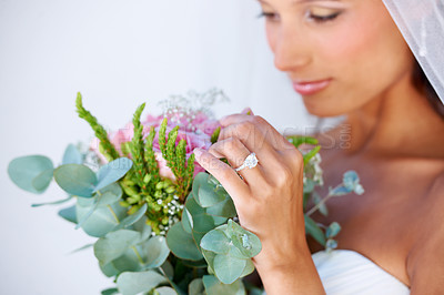 Buy stock photo Bridal, wedding and woman with flowers, veil and engagement ring for marriage ceremony. Jewelry, beauty and young bride with makeup face and floral bouquet for elegant, romantic and love reception.