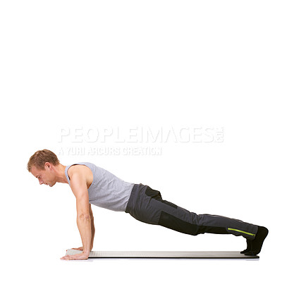 Buy stock photo Man, workout and mat in studio for push ups, fitness or exercise for healthy body, wellness or core muscle. Person, balance and training on floor or abdomen health on mockup space or white background