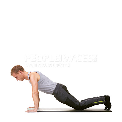 Buy stock photo Man, fitness studio and push up exercise on knees for workout, power and energy on mockup white background. Profile of healthy guy balance on mat for strong core, training or plank challenge on floor