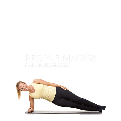 Buy stock photo Woman, yoga and mat in studio with side plank, fitness or workout for healthy body, happy or core muscle. Person, portrait and pilates on floor for abdomen health on mockup space or white background