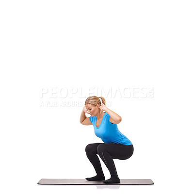 Buy stock photo A young woman crouching on her exercise mat while isolated on a white background