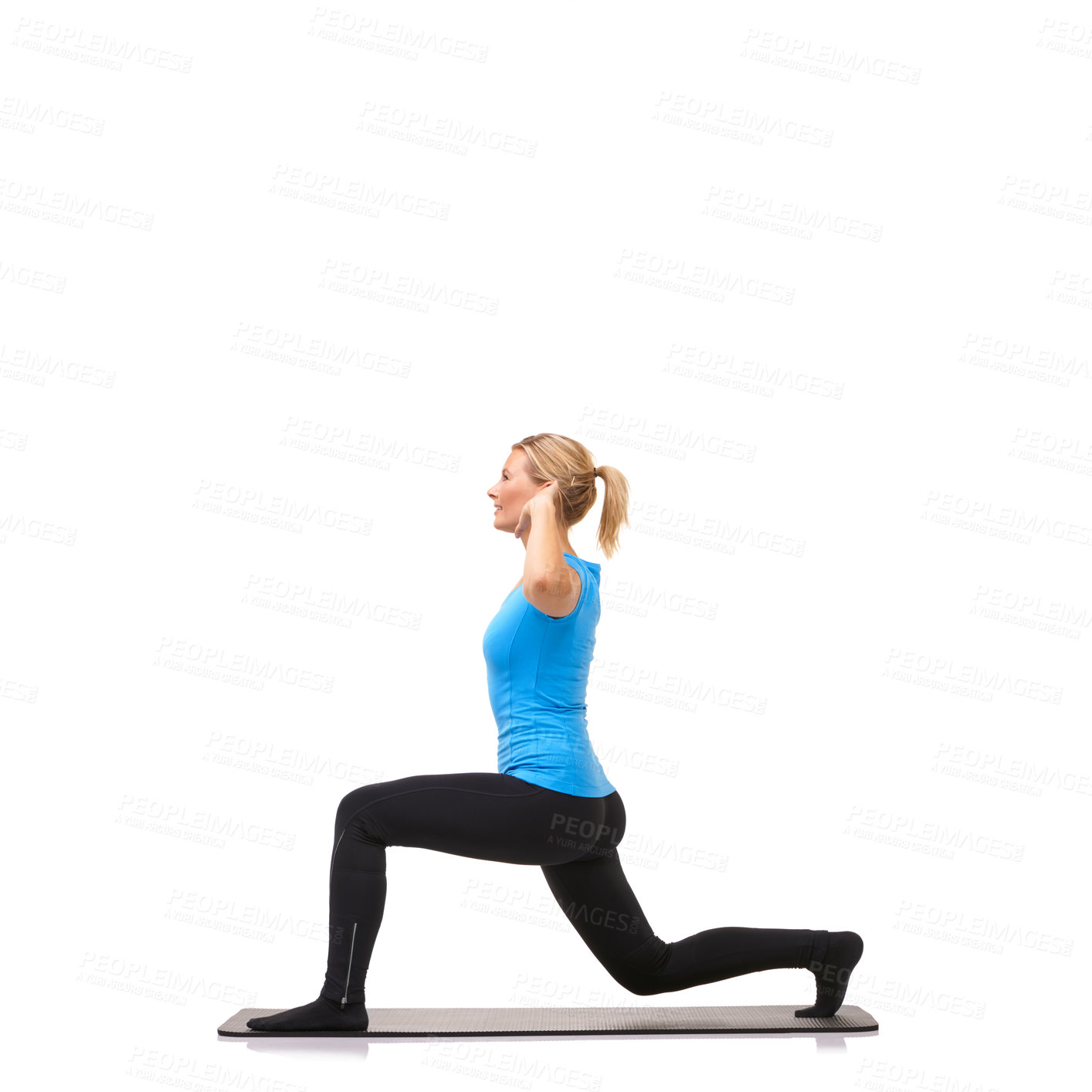 Buy stock photo A young woman performing lunges on her exercise mat while isolated on white