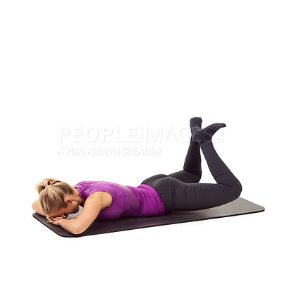 Buy stock photo A young woman lying on her stomach and clenching her thighs and glutes