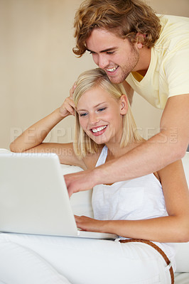 Buy stock photo Love, laptop and couple on a sofa with social media search, movies or streaming at home together. Online shopping, relax and people in living room checking ecommerce, website or deal, sale or survey
