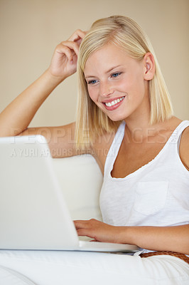 Buy stock photo Laptop, relax and happy woman on a sofa with social media, streaming or website scroll in her home. Tech, movies and female person online in living room chilling with subscription service in a house