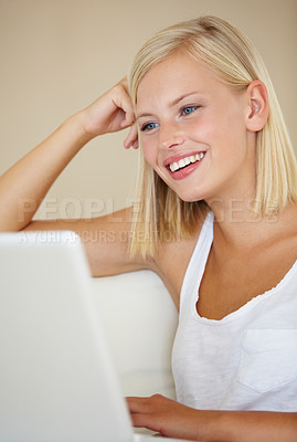 Buy stock photo Relax, laptop and happy woman on a sofa with social media, streaming or website scroll in her home. Tech, movies and female person online in living room chilling with subscription service in a house