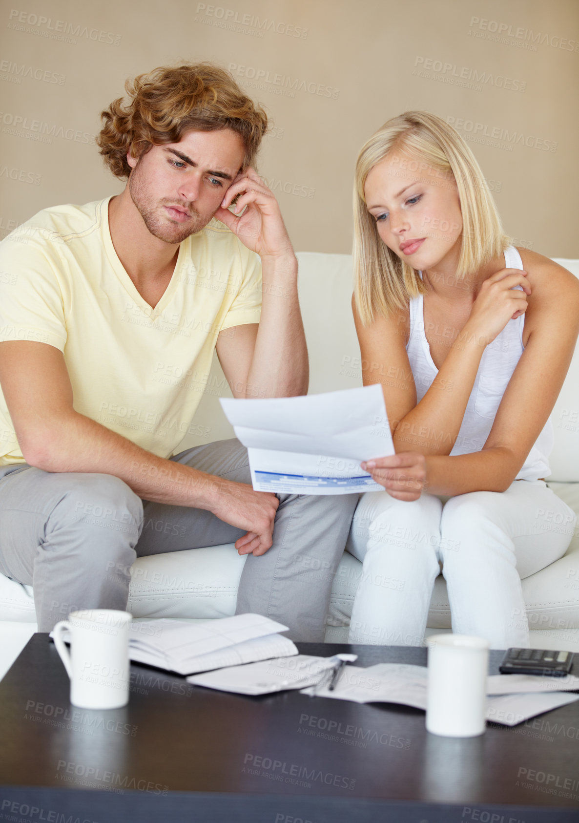 Buy stock photo Sad couple, bills and documents stress on sofa in debt, financial planning and budget risk or worry at home. Young woman and man with depression, reading paper and loan, bankruptcy or mortgage letter