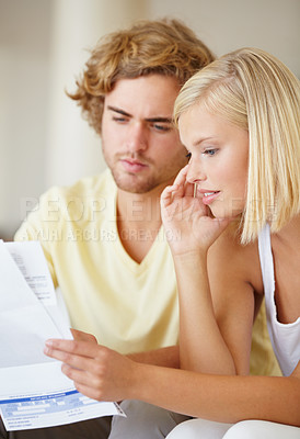 Buy stock photo Paper, finance and couple with documents in a house for future planning, investment or asset management. Paperwork, insurance and people in a living room for bills, mortgage or home loan application