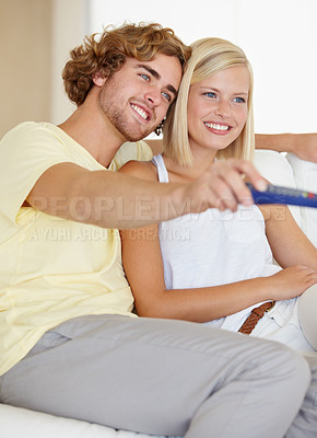 Buy stock photo Relax, remote control and couple watching tv on a sofa happy with streaming, subscription or service in their home. Love, television and couple in living room with movie, video or film entertainment