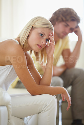 Buy stock photo Divorce, fight and couple on sofa with stress, anxiety or cheating depression in their home. Marriage, crisis and frustrated woman overthinking in living room with commitment, doubt or liar conflict