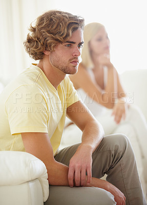 Buy stock photo Angry couple, fight and divorce stress on a sofa with argument, anxiety or cheating depression in their home. Marriage crisis, dispute and overthinking man ignore frustrated woman in a living room