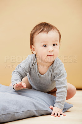 Buy stock photo Portrait of a cute infant crawling on the floor and smiling at the camera