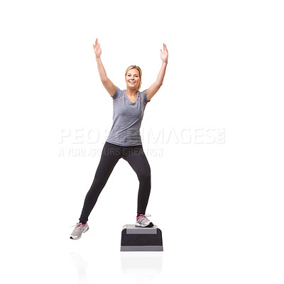 Buy stock photo A smiling young woman doing aerobics on an aerobic step against a white background - K-step