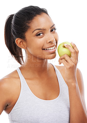 Buy stock photo Young woman, apple and eating of healthy food for nutrition, detox and wellness in a studio portrait. Happy african person with green fruit for smile, lunch or vegan choice on a white background