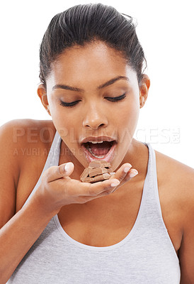 Buy stock photo Diet, sweets and woman with chocolate, eating and wellness isolated on a white studio background. Cocoa, person and model with fitness, candy and unhealthy snack with mockup space, hungry and food