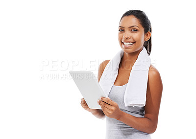 Buy stock photo A young woman in gym clothes working on a digital tablet