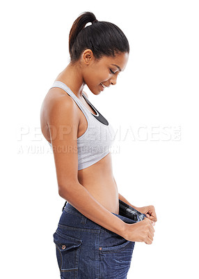 Buy stock photo Happy woman, pants size and weight loss in diet or fitness against a white studio background. Slim young female person or model smile for thin waist, results or health and wellness on mockup space