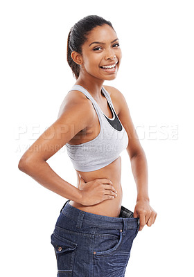 Buy stock photo Happy woman, portrait and weight loss in diet with pants size in fitness against a white studio background. Slim young female person or model smile for thin waist, results or health and wellness