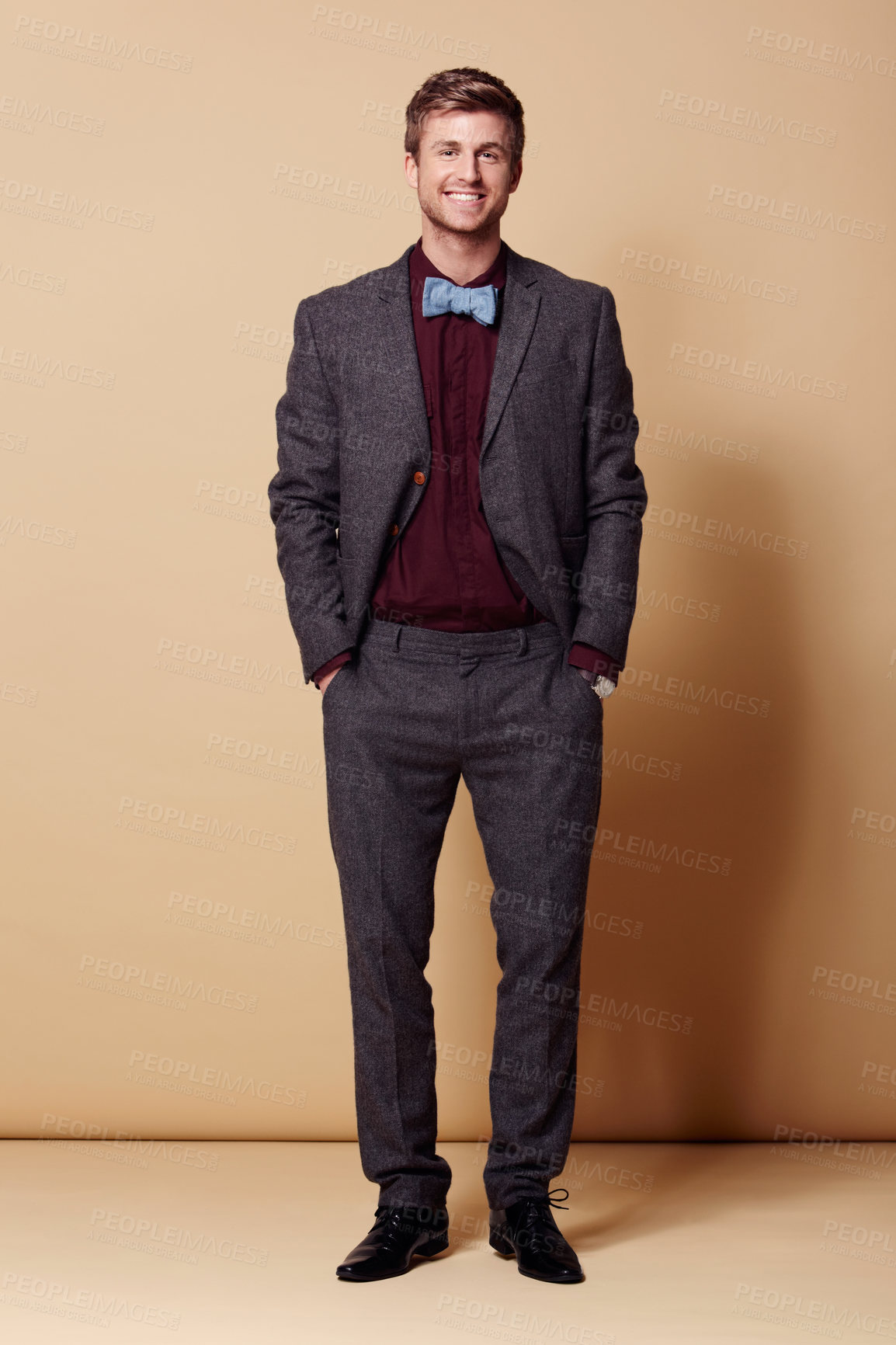 Buy stock photo Full length studio portrait of a stylishly-dressed young man smiling at the camera