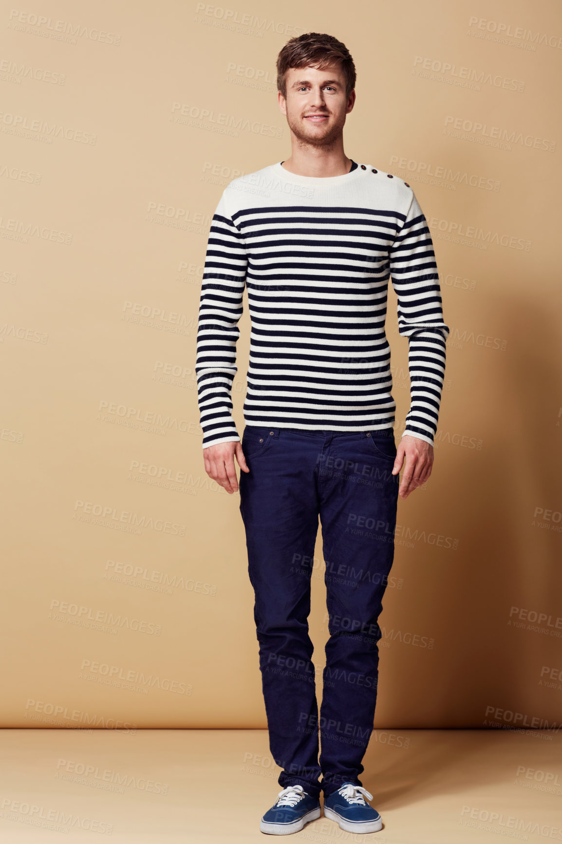Buy stock photo Fashion, stripe and portrait of man on beige background in trendy, stylish and casual clothes. Confident, attractive and happy person with style for positive attitude, pride and smile in studio
