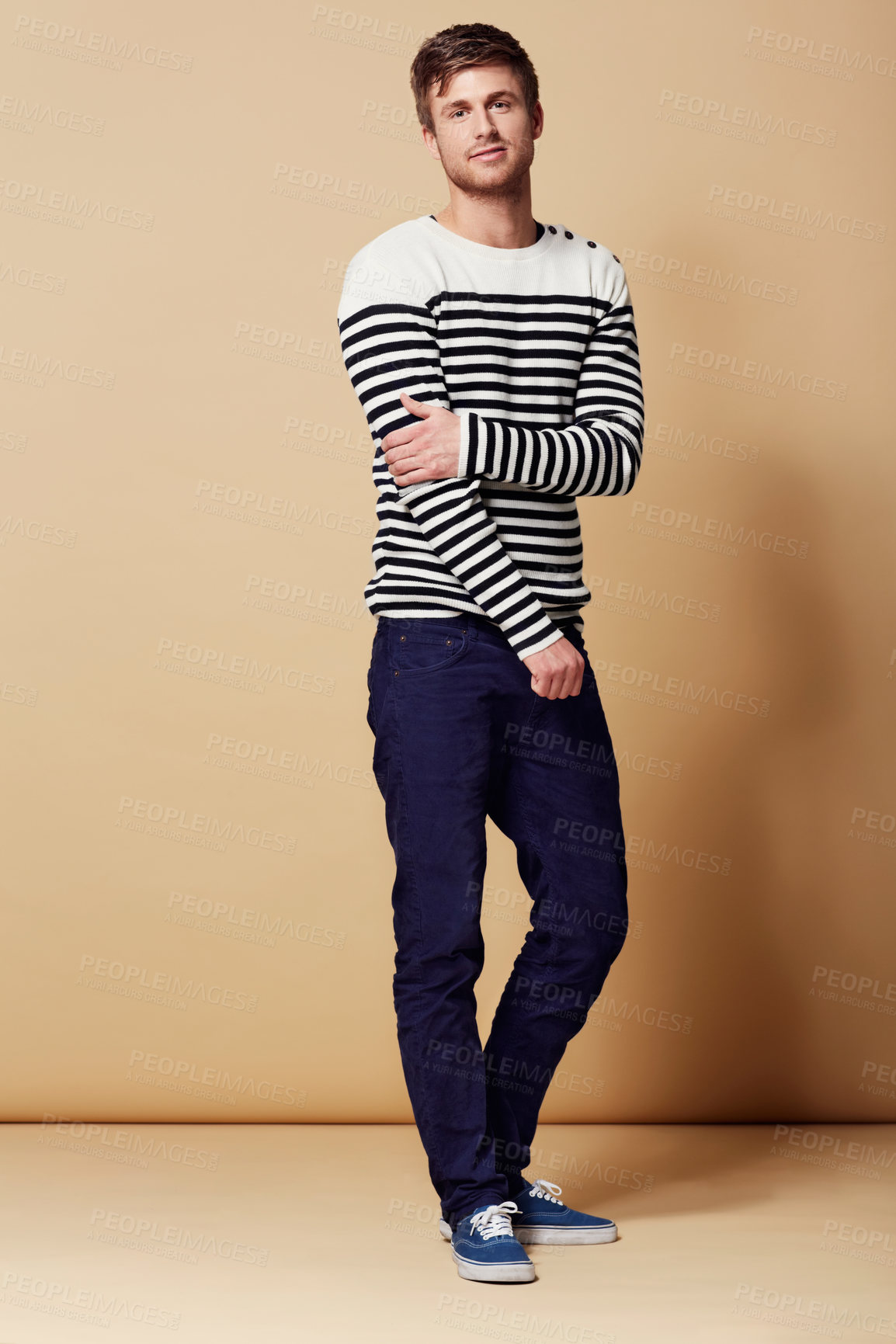 Buy stock photo Fashion, confidence and portrait of man on beige background in trendy, stylish and casual clothes. Happy, hipster and person with stripe style for positive attitude, pride and smile in studio